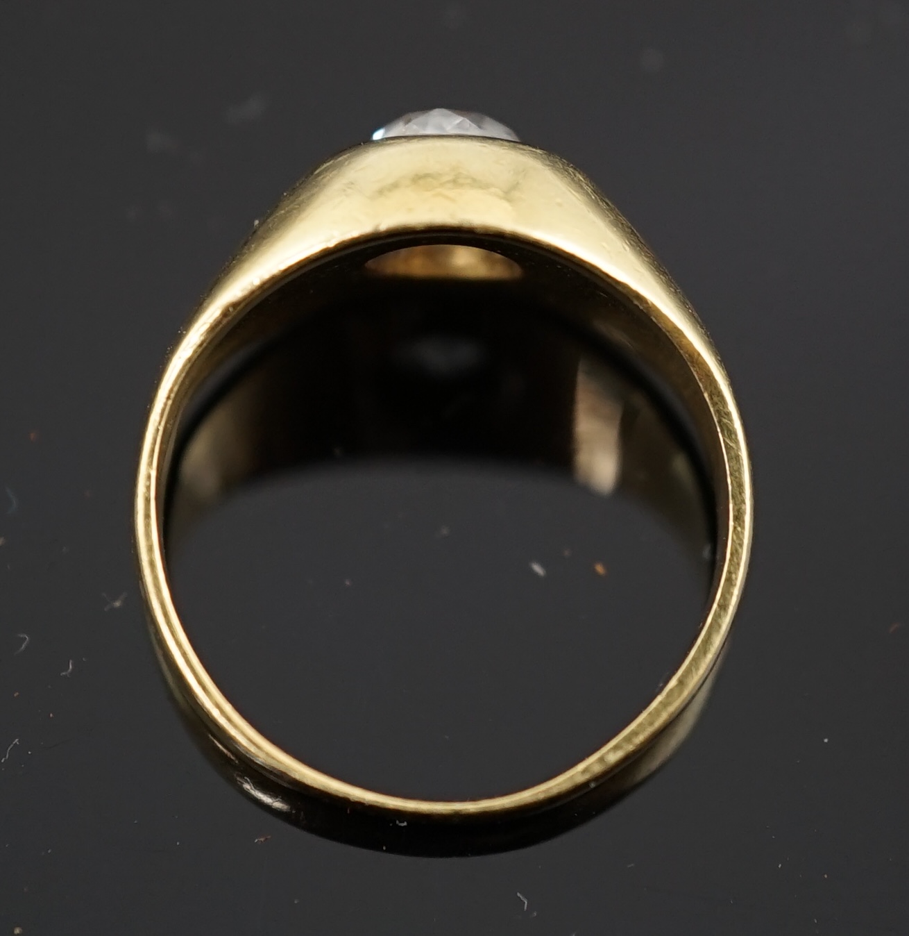 A gold and gypsy set old round cut diamond ring